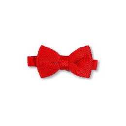A children's pillar box red knitted bow tie. The bow tie is made of a soft, knitted material in a vibrant red color, creating a classic and stylish accessory for children.