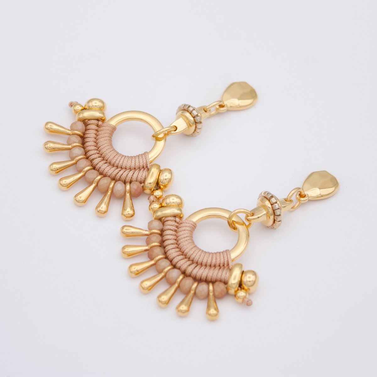 TIBÚ beige and gold statement earrings