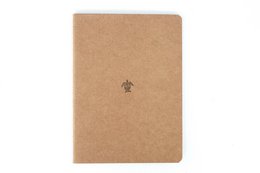 A5 size notebook made of kraft paper with a simple logo design.