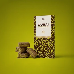 Brown milk chocolate with pistachio and kunafa pieces, gold patterned packaging, luxury gift box