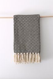 A luxurious 100% cotton blanket with a diamond pattern, available in a variety of colors including turquoise, beige, black, blue, light grey, curry yellow, aqua green, grass green, grey, navy, light blue, orange, and yellow. The blanket features a soft, woven texture and fringed edges for a stylish and cozy look.