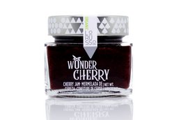 Organic gourmet handmade cherry jam with 85% fruit content, packaged in a glass jar with a diamond-patterned design.