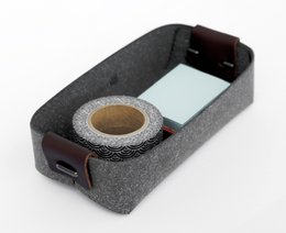 Recycled leather card holder in maroon chocolate, camel, and grey colors. Compact and minimalist design with a sleek, rectangular shape.