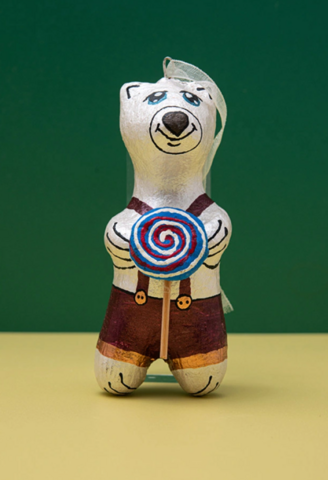 Handmade papier-mache Bear with a candy