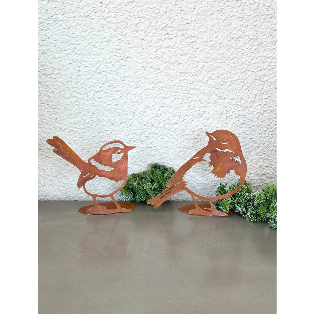 Pájaro fabricado en acero inoxidable con aspecto de acero corten.