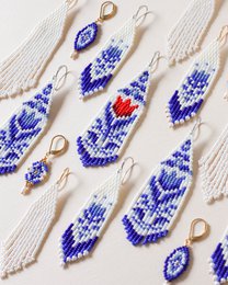  Blue and white patterned statement earrings with a red accent. Handcrafted beaded design in a diamond shape.