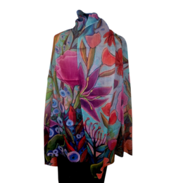 Colorful floral scarf with vibrant pink, red, blue flowers and botanical leaves on dark background.