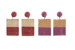 A set of statement earrings made with raffia and metal. The earrings feature a layered design in shades of red and purple.