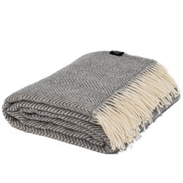 A gray and white herringbone patterned throw blanket with fringe along the edges.