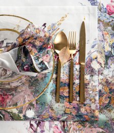 Colorful floral table mat with intricate patterns, suitable for formal dining or decorative display.