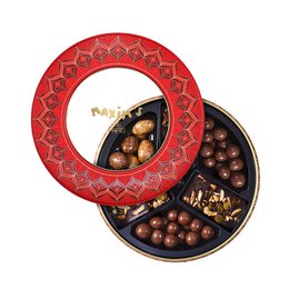 Round tin filled with assorted chocolate truffles and candies. Includes a variety of flavors and textures, perfect for seasonal gifting or indulgence.