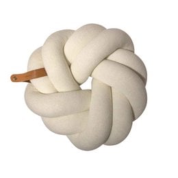A round, plush white cushion with a knotted design, suitable for use as a decorative pillow.