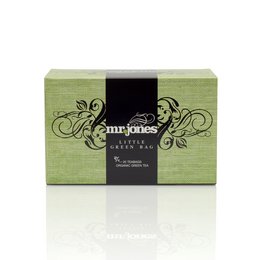 A small green tea bag box with a black and white floral design. The product is called "Mr. Jones - Little Green Bag" and is categorized as tea.
