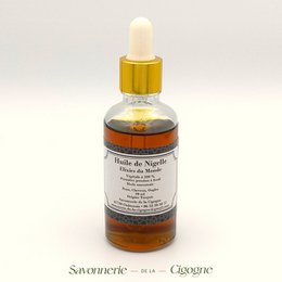 Nigella oil 50ml, a face oil with a golden-amber color and a glass bottle with a dropper.