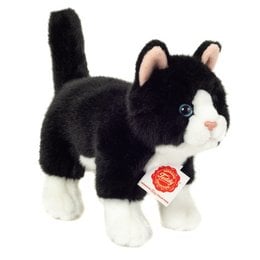 A black and white plush cat toy, approximately 20 cm tall, with a soft and cuddly texture.