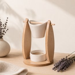 Ceramic and bamboo oil burner with melting and scented waxes for home fragrance and gift ideas.