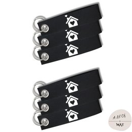 Black felt keychain with white home icon design. Compact and durable for everyday use.