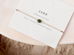 Jade beaded bracelet with a simple, elegant design. Features a single jade stone as the focal point.
