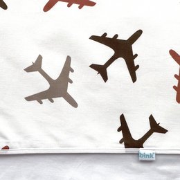 Crib sheet featuring a repeating pattern of brown airplane silhouettes on a white background. The sheet is suitable for a crib or toddler bed, with a soft, comfortable material.