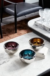 Small round mirror bowl in amber, teal, and purple colors. Decorative bowls with metallic finishes.