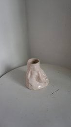 A handmade, matte gray vase with a simple, cylindrical shape.