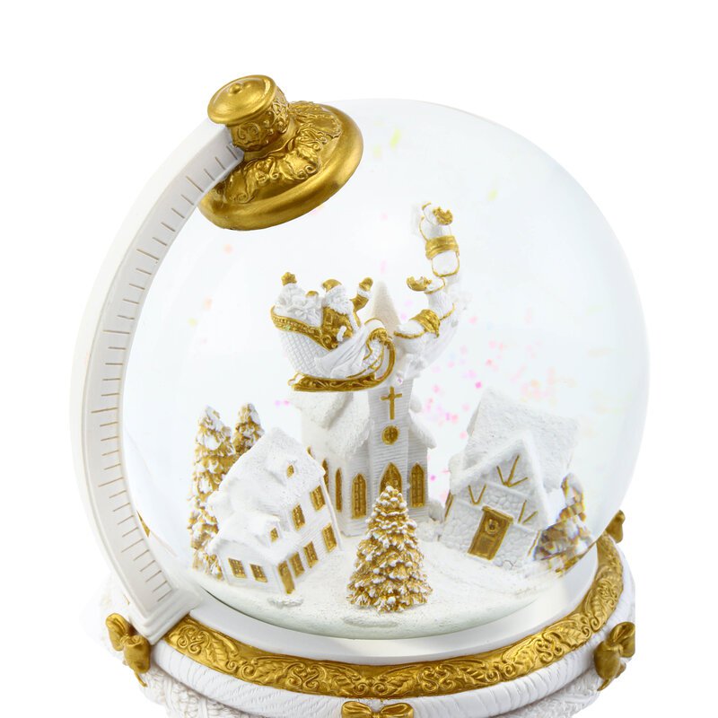 Die kugelförmige Weihnachtsschneekugel mit automatischem Schneesturm und Lichtern.