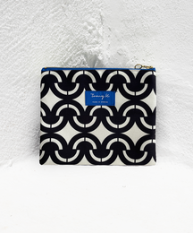  "Small black and white patterned pouch with a blue zipper closure. Compact and stylish accessory for carrying essentials."
