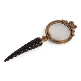 A small, round magnifying glass with a wooden frame and a black cord handle. The magnifying glass appears to be a desktop organizer or accessory.