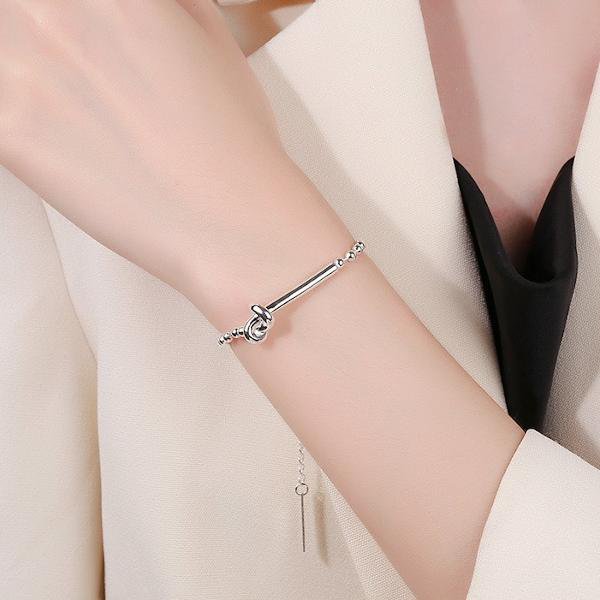 Bracciale con catena a sfere e design con nodo in argento