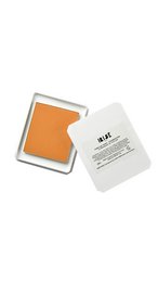 Oregano Pine Powder Foundation, a face product with an orange powder texture and compact packaging.