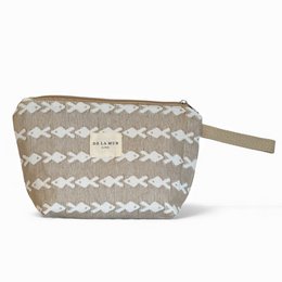 Large beige and white patterned toiletry bag with zipper closure and wrist strap.