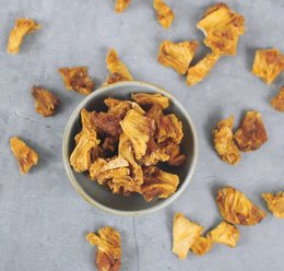  "Dried pineapple chunks, golden yellow color, crispy texture, natural fruit snack, 2.5 kg bulk package"