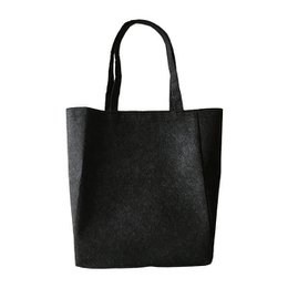  Black shoulder bag made from recycled PET material.