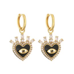 Elegant heart-shaped drop earrings with black and turquoise enamel accents and sparkling crystal embellishments. The gold-tone metal setting creates a luxurious look.