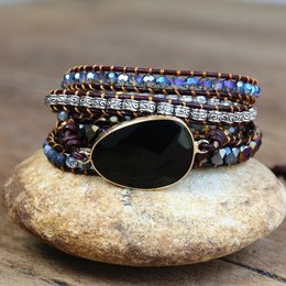 Onyx and beaded wrap bracelet with a dark, elegant style.
