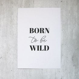 A black and white poster with the text "Born to be wild" in a bold, stylized font. The poster has a minimalist, modern design that would be suitable for home decor or as wall art.