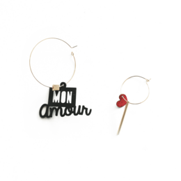 Mismatched hoop earrings with "Mon amour" text charm and red heart charm, silver and gold options.