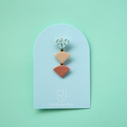 Porcelain brooch with geometric shapes in stripes, nude, red, kobalt, and ocean colors.