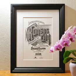 This vintage-style poster features the text "Kansas City" in a bold, decorative font against a textured background, indicating it is a poster or artwork celebrating the city of Kansas City, USA.