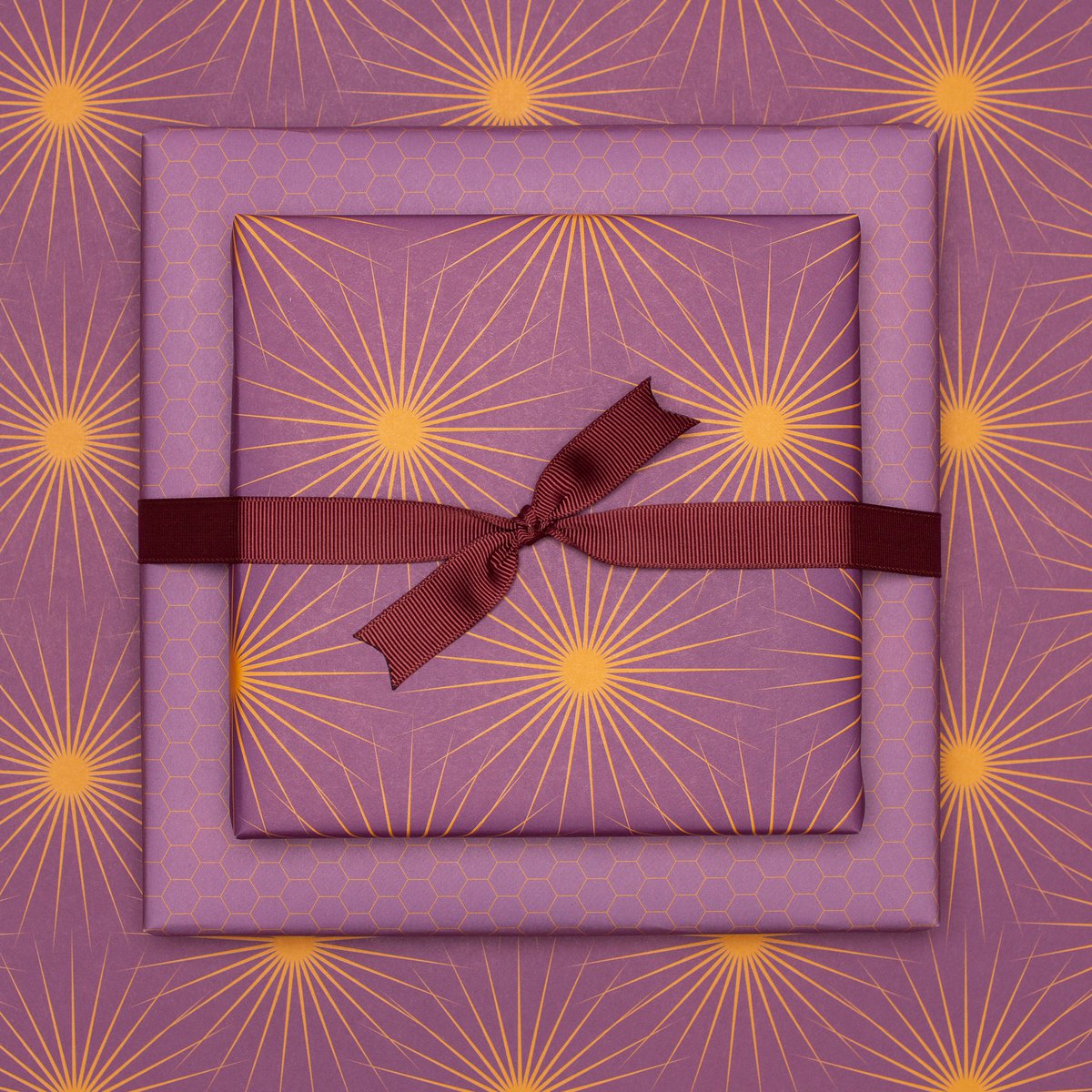 Lila Geschenkpapier mit Sonnensternen, retro Geschenkpapier orange und lila, ideal als Geburtstags- Geschenkpapier Frühling oder Weihnachtsgeschenkpapier