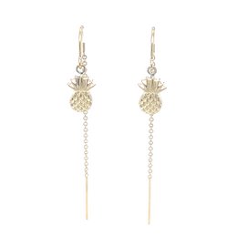 Pineapple-shaped gold-tone ear climber earrings with dangling chain accents.