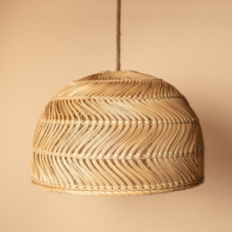 Rattan pendant lamp with a woven, dome-shaped design in a natural beige color.