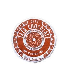 Dark chocolate coffee disc with 55% cocoa content, organic and fair trade certified.