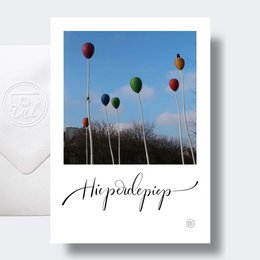 Colorful balloons floating against a blue sky, with the text "Hip hip!" indicating a birthday card.
