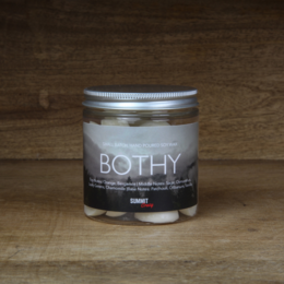 Scented wax melts in a variety of natural fragrances including Oasis, Botanist, Bothy, and Nomad. The round, tall candle jars feature a minimalist design.