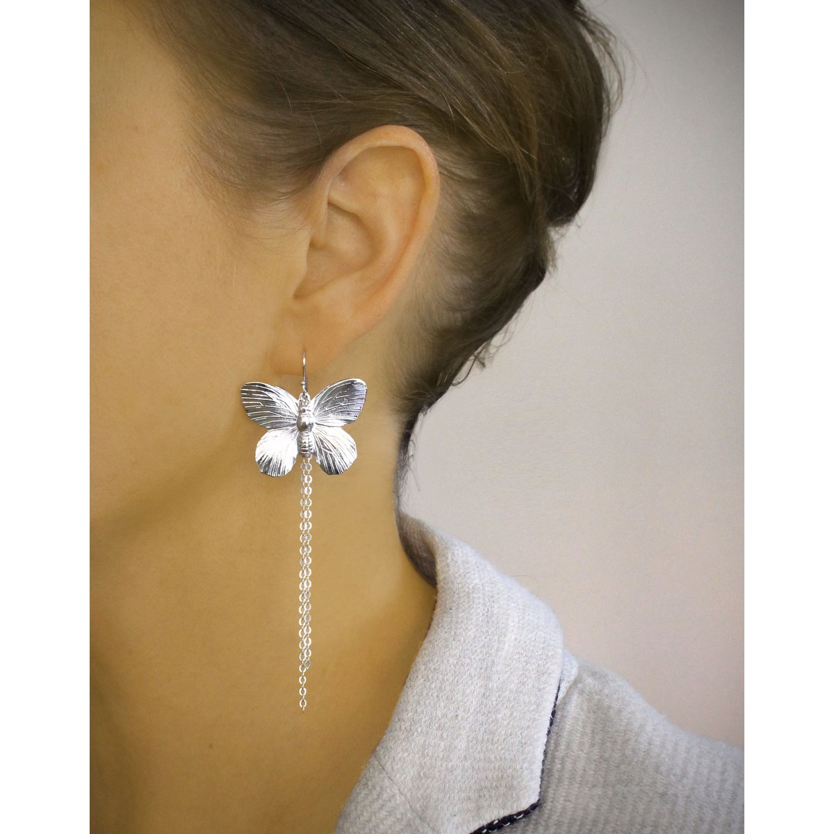 Long-length rhodium plated butterfly earrings