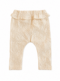Beige textured baggy baby pants with elastic waistband and drop crotch design.