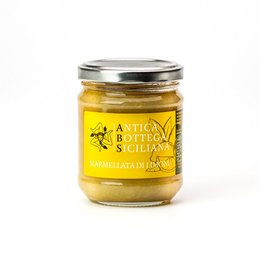Sicilian lemon jam in a glass jar with a silver lid. The jam has a bright yellow color and appears to be a thick, spreadable consistency.