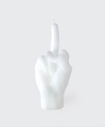 White candle in the shape of a hand with a middle finger raised.