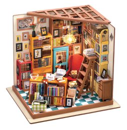 A cozy and cluttered study room with bookshelves, framed artwork, and various decorative items. The room has a warm, vintage-inspired aesthetic.